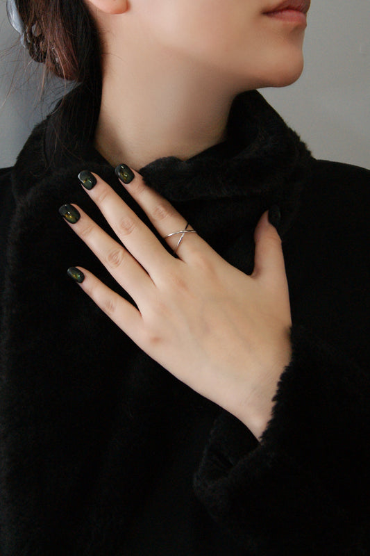 lightning press-on nail, a lady wear it with black coat
